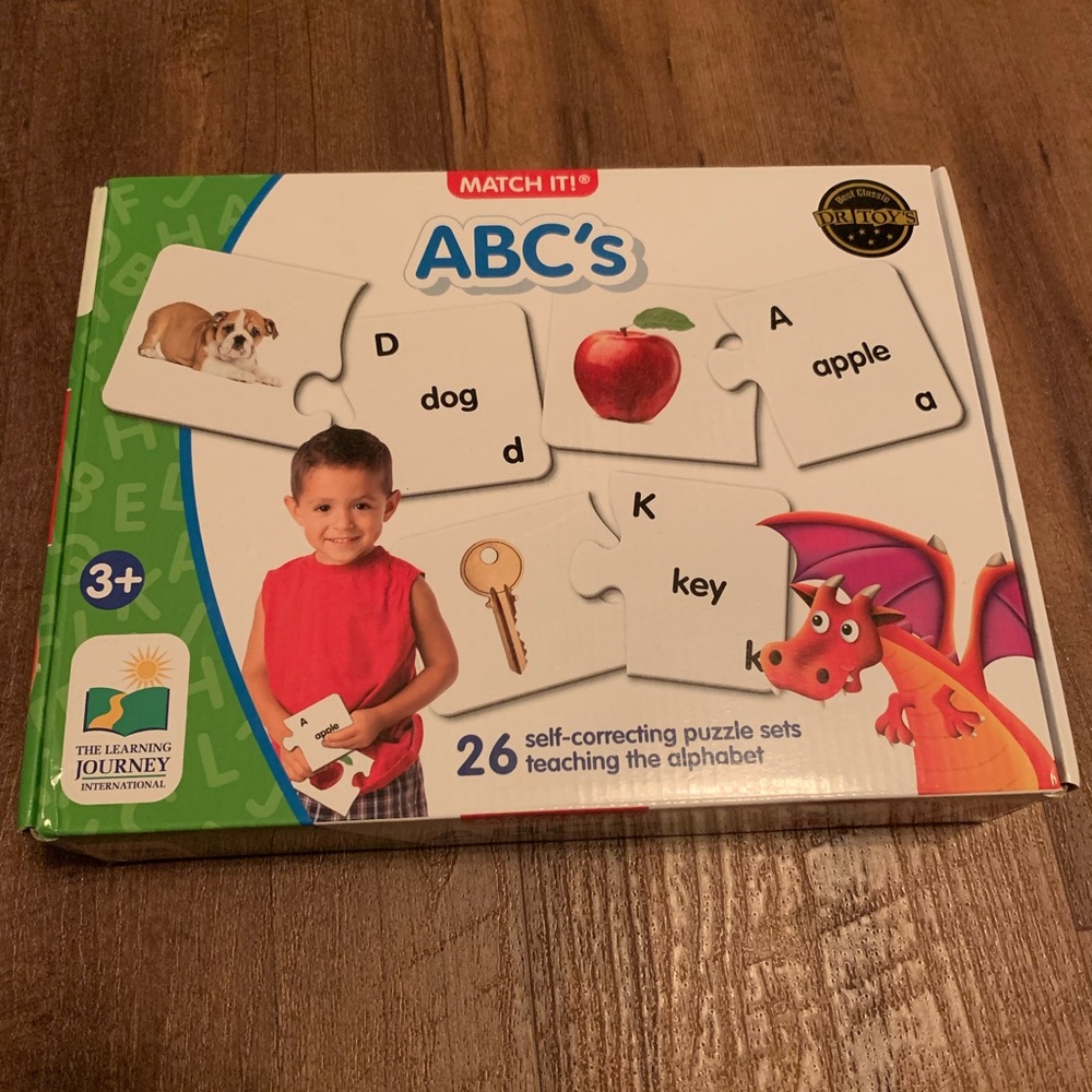 Game/puzzle for ages 3 and up which teaches letters, words and sounds